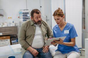 A healthcare professional speaks with a patient who wants to know more about how long tirzepatide side effects last.
