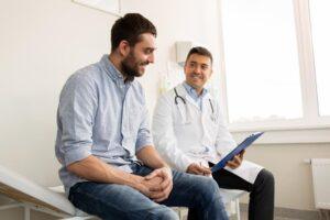 A healthcare professional talks to his patient, who asks the question, "How long do you stay on semaglutide for weight loss?